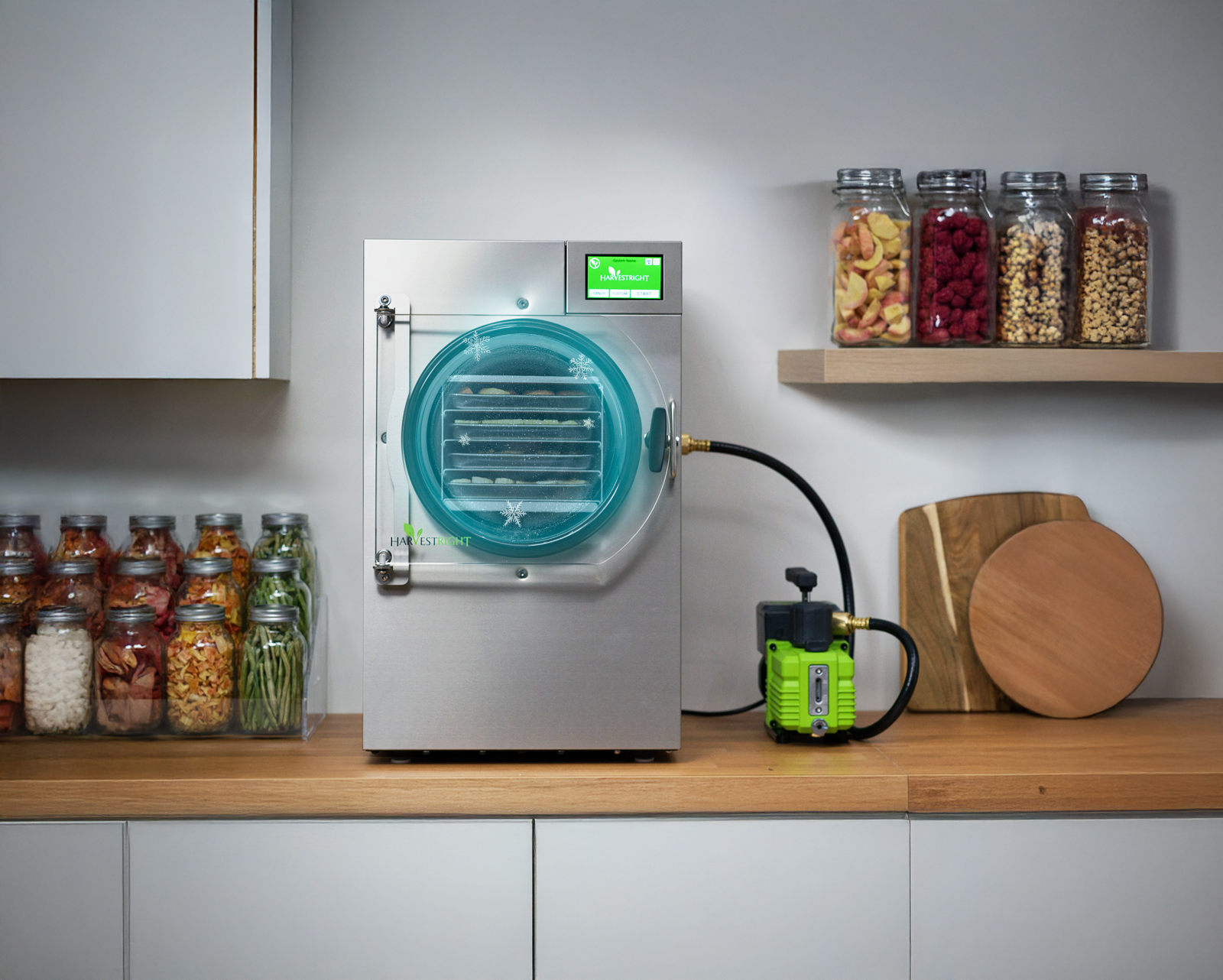 Harvest Right freeze dryer on a kitchen counter with jars of food in the background