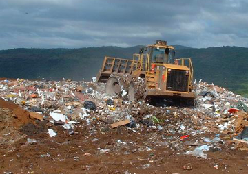 a bulldozer on a landfill