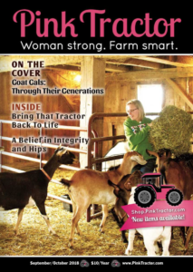 Pink Tractor magazine cover, woman in a barn with goats