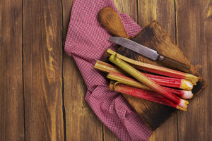 Fresh rhubarb on wooden cutting board