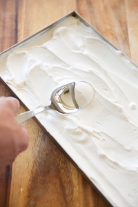 yogurt being spread into a tray