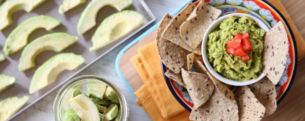 freeze dried avocado slices next to chips and guacamole