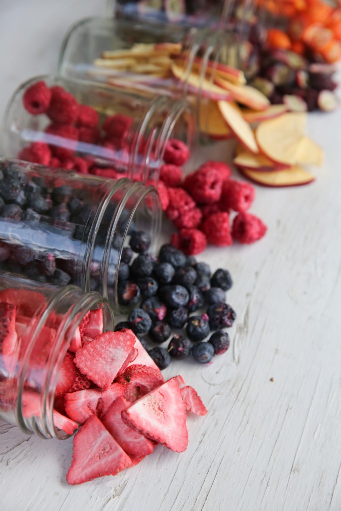 freeze dried fruit spilling out of glass jars