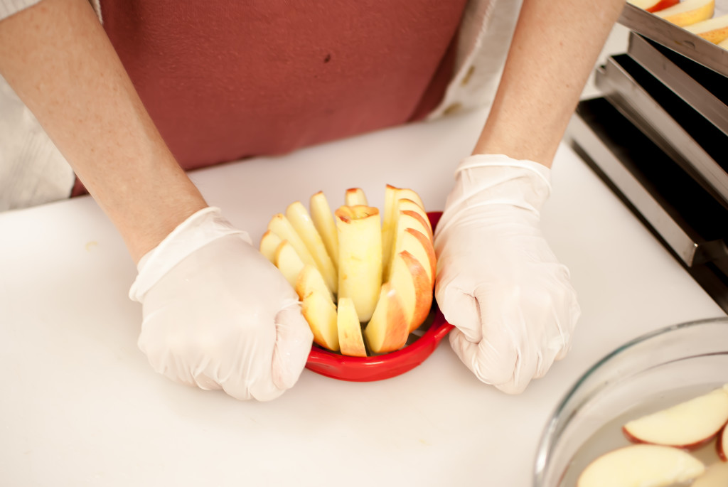 an apple being cored and sliced