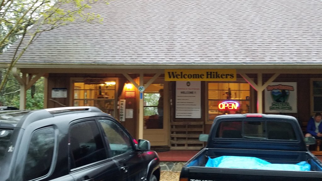 storefront with a sign that says Welcome Hikers