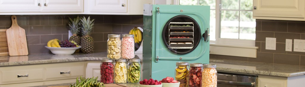aqua freeze dryer in a kitchen surrounded by freeze dried food