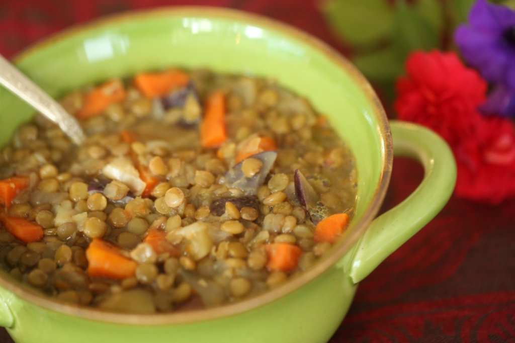 lentil soup in a green bowl