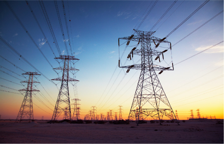 Power lines and transmission towers at sunset