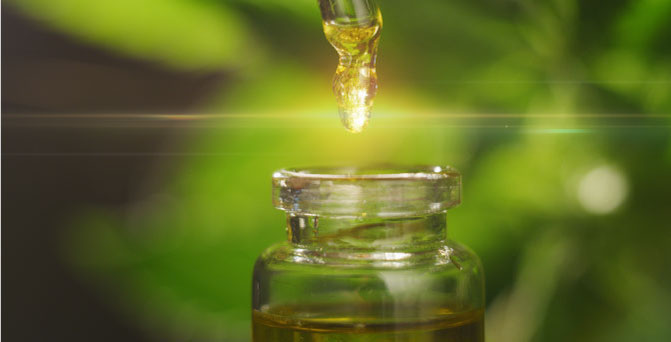 a drop of oil above a glass container